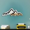 Decorative mirror featuring a printed mountain landscape.