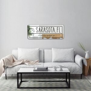 Mirror with 'Sarasota Florida' and GPS coordinates etched.