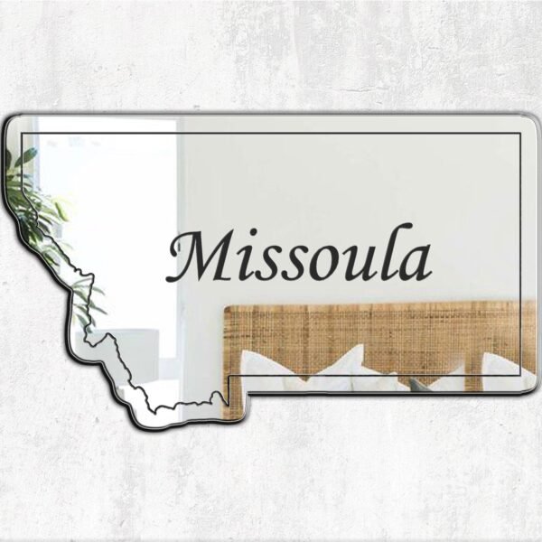 Wall mirror featuring printed Missoula landscape and lettering.