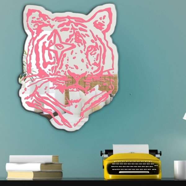 Mirror with a pink tiger print frame.