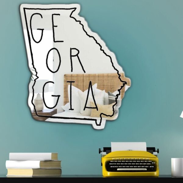 Mirror with 'Georgia' in white paint across it.
