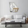 Text 'Georgia' painted in white on a mirror.