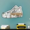 Mirror showcasing the design of a Jordan 4 sneaker.
