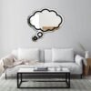 Empty thought bubble-shaped mirror on white wall.