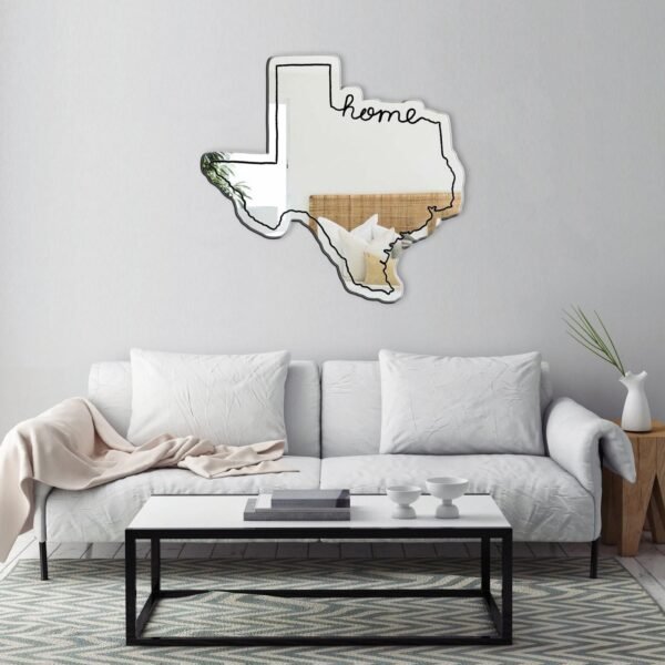 Texas-shaped mirror with a vintage wooden border.