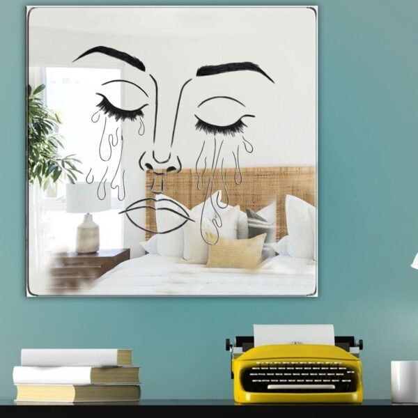 Decorative mirror featuring a crying woman's silhouette.