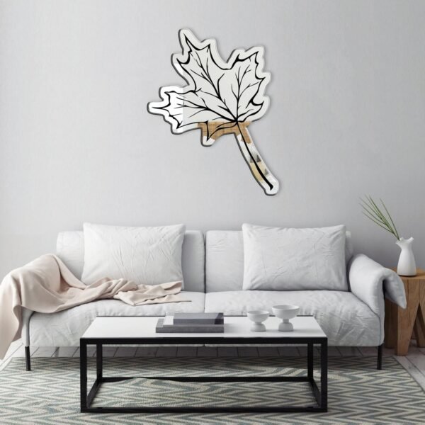 Maple leaf design on a stylish wall mirror.