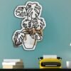 Monstera leaf-shaped mirror for home decor.