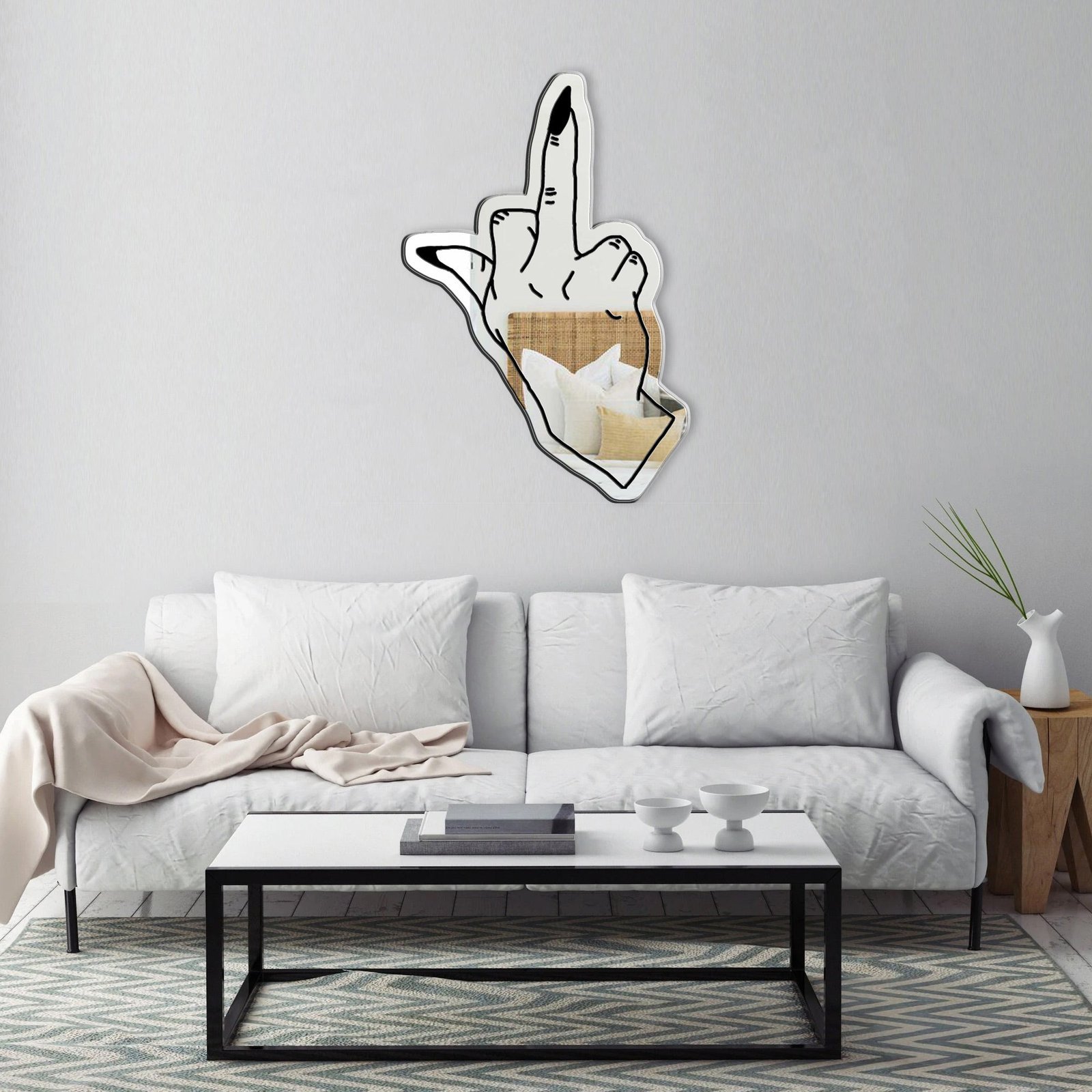 Decorative mirror shaped like a hand giving the middle finger.