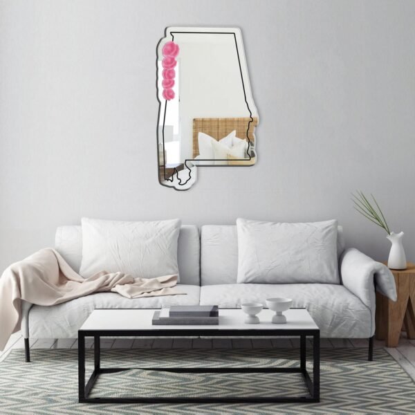 Frameless pink mirror shaped like Alabama.