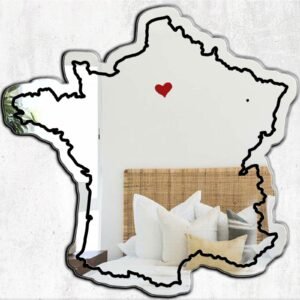 Decorative mirror shaped like a heart with Paris landmarks.