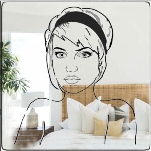 Girl-shaped adhesive mirror on a white wall.