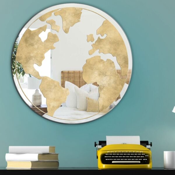 Reflective gold spherical mirror in a modern room.