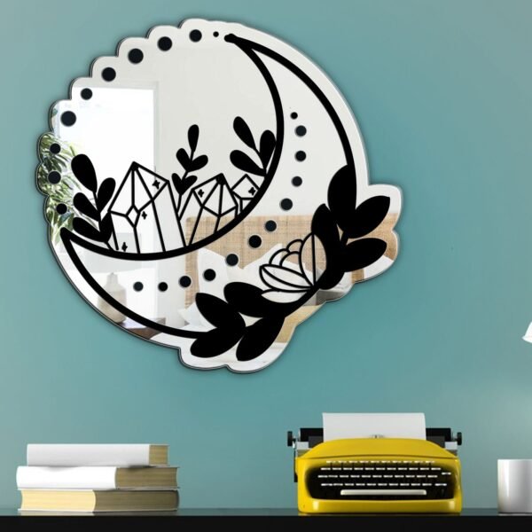 Crescent moon-shaped wall-mounted mirror.