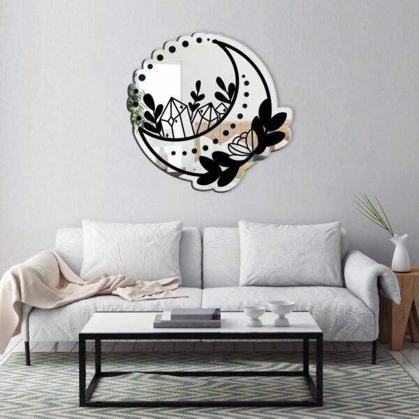 Wall-mounted mirror shaped like a crescent moon.