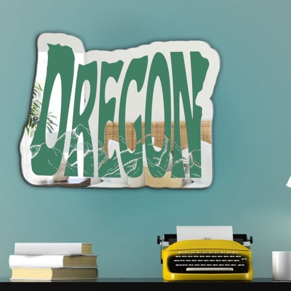 Wall-mounted mirror in the shape of Oregon with Pacific Northwest-themed details etched into the design.