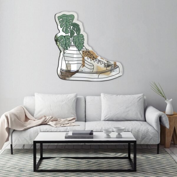 Vans SK8 Hightop sneakers with a Monstera leaf pattern, displayed on a mirror.