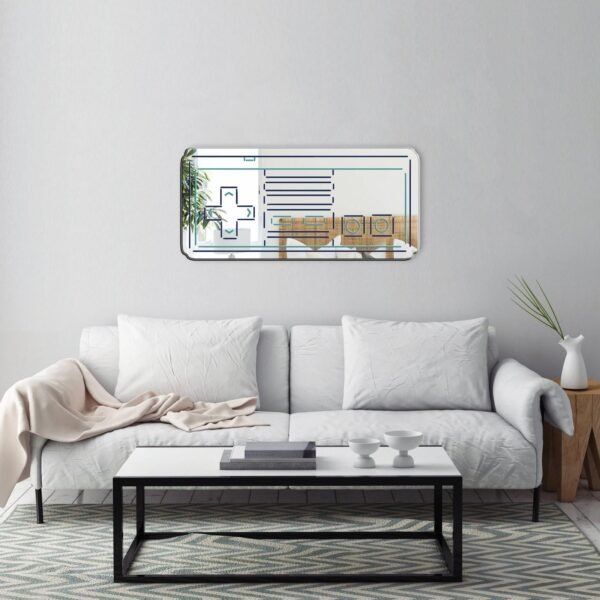 Vintage game controller mirror on a white wall.