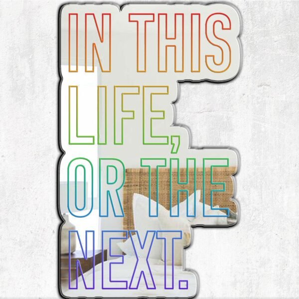 "In this life or the next" rainbow artistic text on a Warrior Nun-themed mirror.