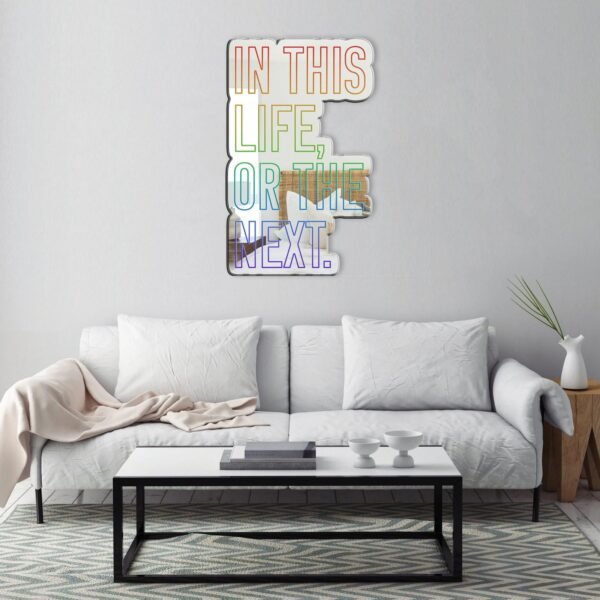 "In this life or the next" rainbow artistic text on a mirror with Warrior Nun theme.