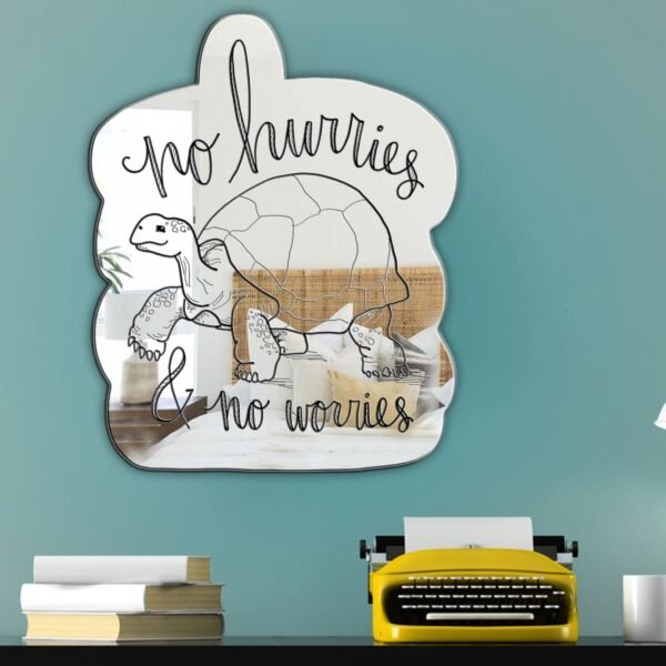 "No Hurries and No Worries" tortoise illustration with calligraphy in black and white on a mirror.