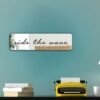 "Ride the Wave" in cursive, simple black custom-painted mirror design.