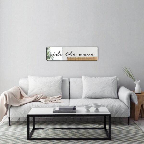 Custom-painted mirror with the phrase "Ride the Wave" in cursive, featuring a simple black design.