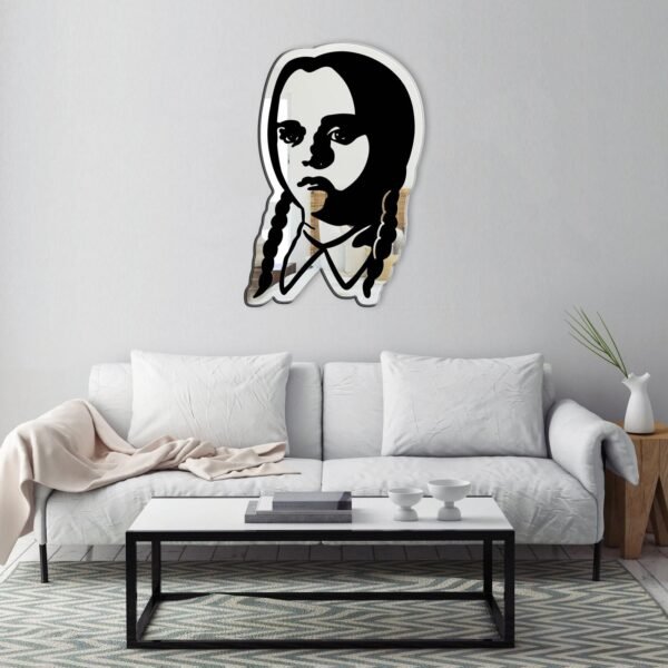 Unique mirror with artistic Wednesday Addams illustration.