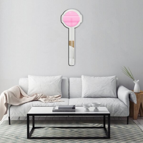 A delightful mirror with a unique pink Dum Dum lollipop candy design, featuring a whimsical swirl pattern and stick handle.