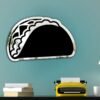 Wall-mounted taco-shaped mirror with vibrant trim.