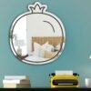 Wall mirror featuring a black flat pomegranate icon in contemporary design.