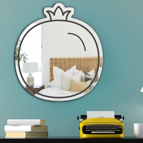 Wall mirror featuring a black flat pomegranate icon in contemporary design.