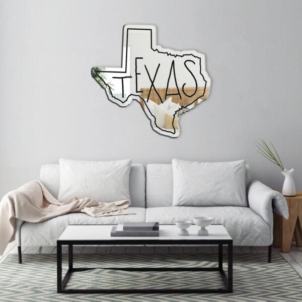 Wall mirror with 'Texas' written in bold on white.