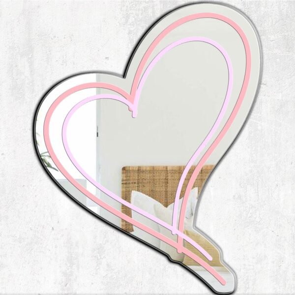 A mirror featuring a pink cool heart design, adding a fun and vibrant touch to any space.