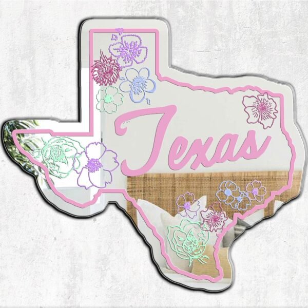 A large wall mirror featuring the outline of Texas, adorned with vibrant floral designs.