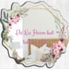 A mirror featuring the words "Do No Harm" in decorative lettering, surrounded by delicate floral designs.