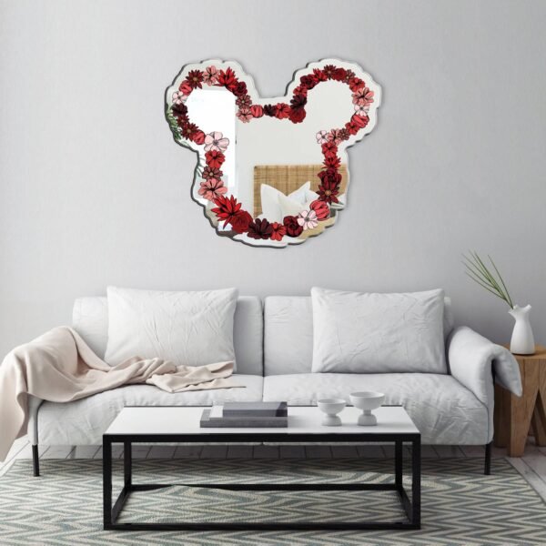 A decorative mirror featuring a floral design inspired by Mickey Mouse, blending whimsical elements with nature.