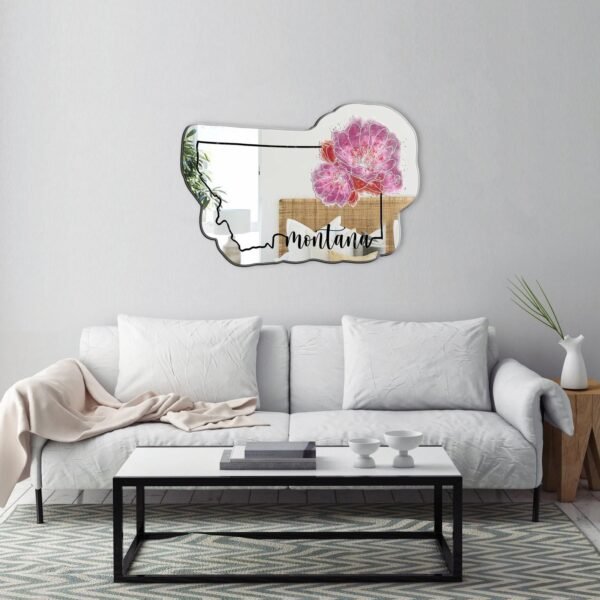 A mirror with a watercolor design of Montana, featuring the Bitterroot, the state flower.