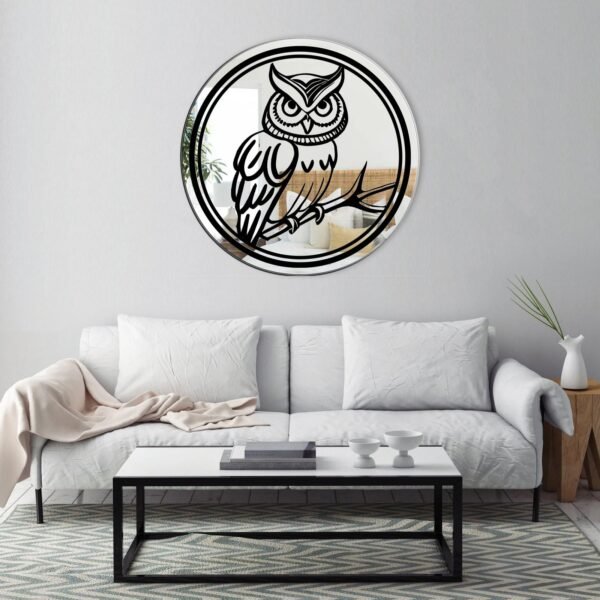 Round mirror featuring an owl print design, adding a whimsical touch to the decor.