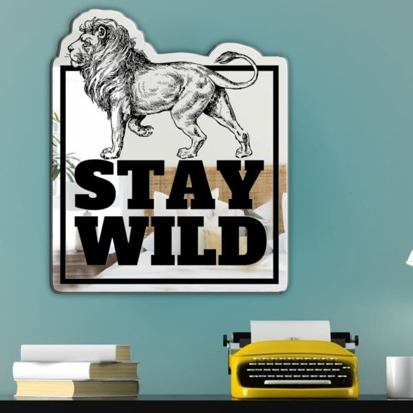 Round mirror with lion design and 'Stay Wild' text.