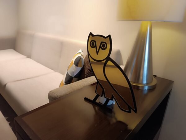 OVO owl mirror in a modern living room setting.