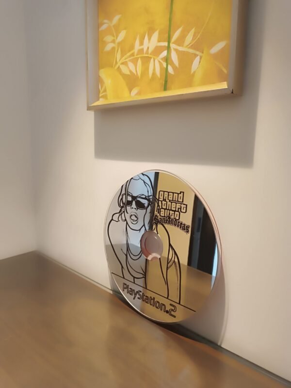 Compact mirror with "GTA San Andreas" disc design.