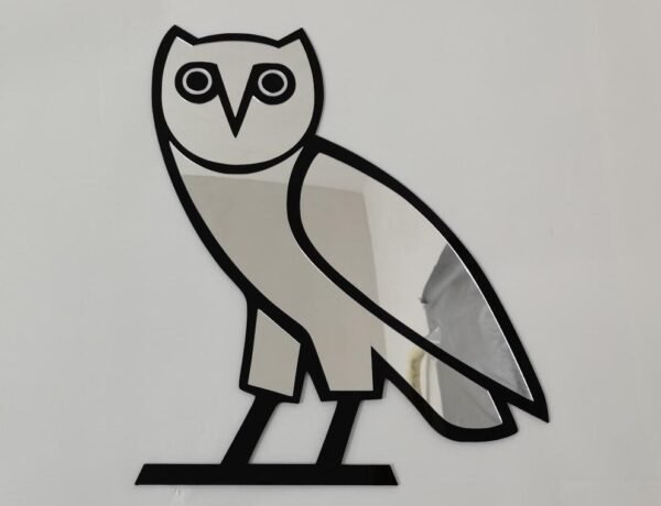 OVO owl mirror displayed in a chic hallway.