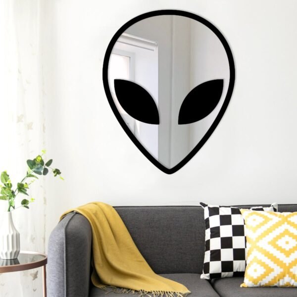 Custom wall mirror with unique alien-themed design.