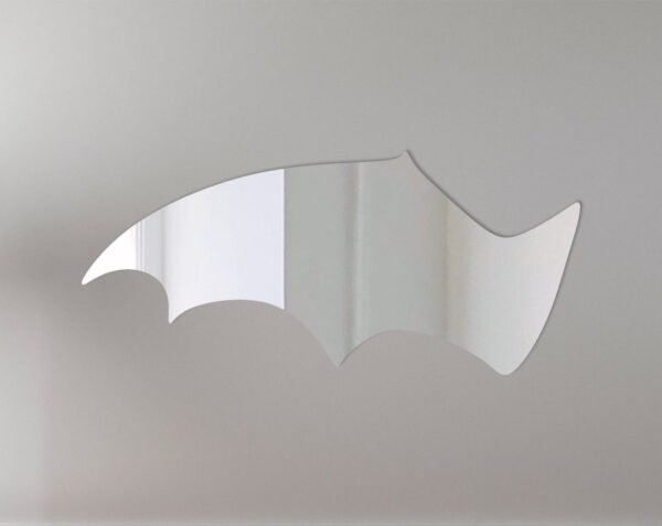 Reflective bat wing-shaped mirror with Halloween sign.