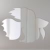 Decorative sign with a reflective surface shaped like a betta fish.