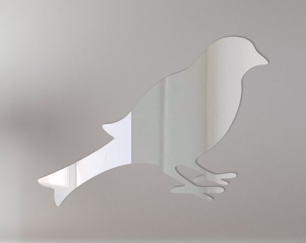 Round mirror with a bird-shaped frame on a white background.