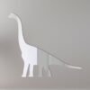 Reflective mirror shaped like a Brachiosaurus dinosaur.