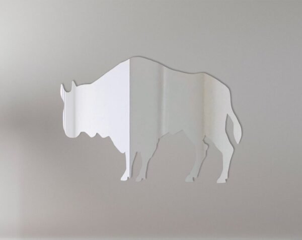 Buffalo-shaped mirror with neon sign border in a dimly lit room.