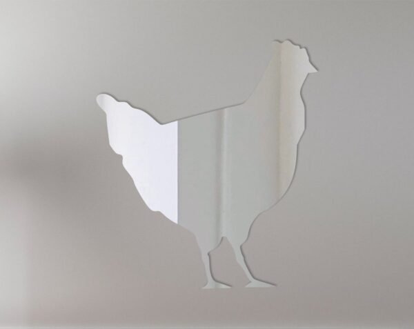 Decorative mirror shaped like a chicken with reflective surface.